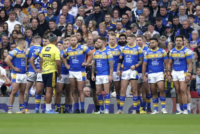 Leeds players look dejected after Matty Lees' early try