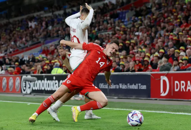 Poland's Piotr Zielinski in action with Wales' Connor Roberts