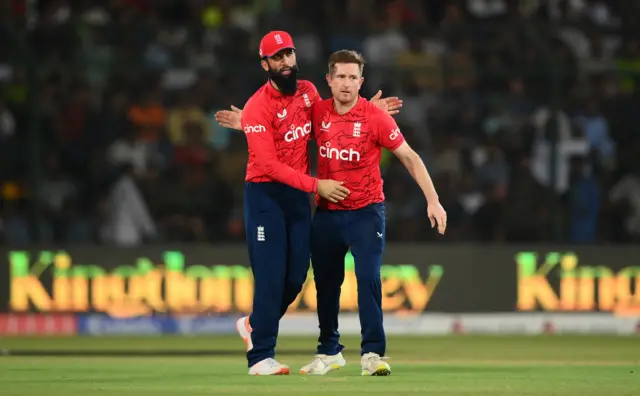 Moeen Ali and Liam Dawson celebrate an England wicket in Pakistan