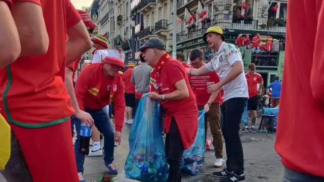 Wales fans cleaning up rubbish