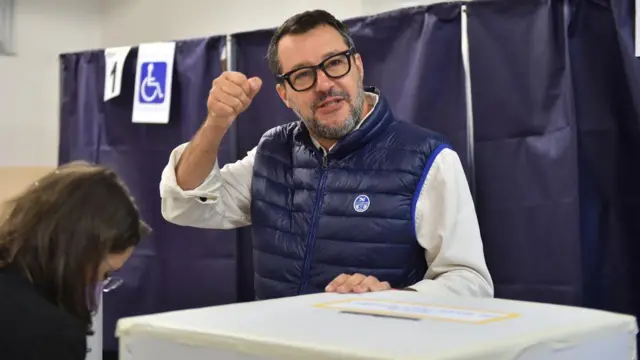 League party leader Matteo Salvini gestures at a polling station during the snap election, in Milan, Italy, September 25, 2022