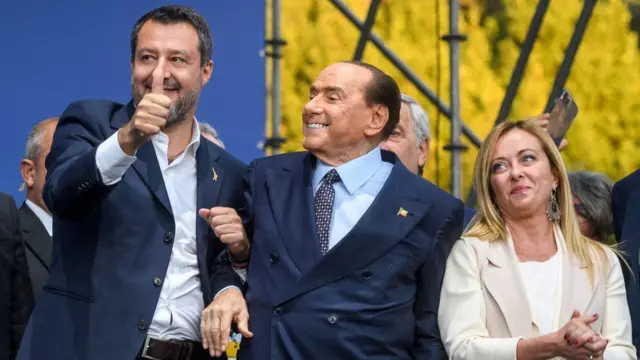 Matteo Salvini standing with Silvio Berlusconi and Giorgia Meloni