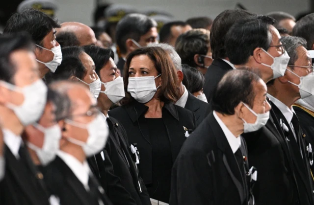 US Vice President Kamala Harris seated among mourners in the funeral hall