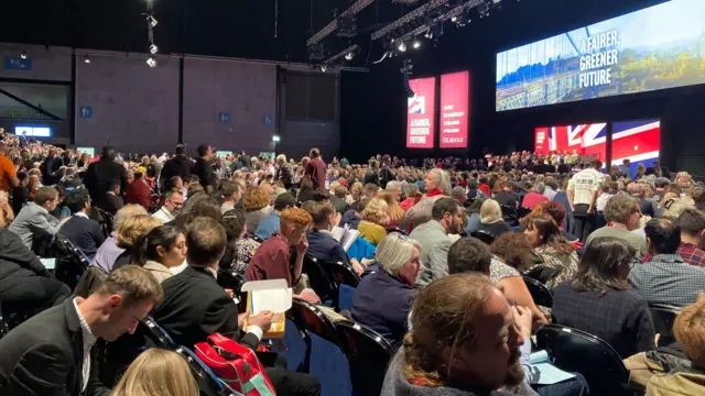 The main conference room fills up ahead of the speech