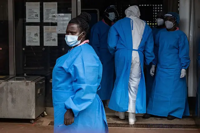 Members of the Ugandan Medical staff of the Ebola Treatment Unit stand inside the ward in Personal Protective Equipment (PPE) at Mubende Regional Referral Hospital in Uganda on September 24, 2022.