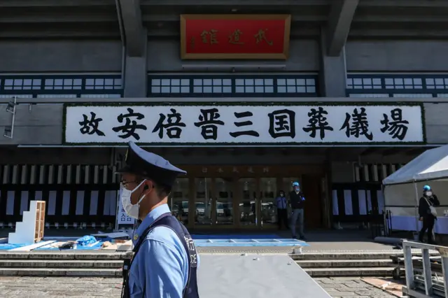 A police officer is seen in front of the Nippon Budokan on September 26, 2022 in Tokyo