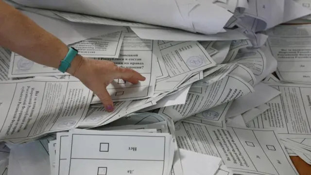 A stack of voting papers from a so-called referendum concerning the future of Russian-held territory in Ukraine