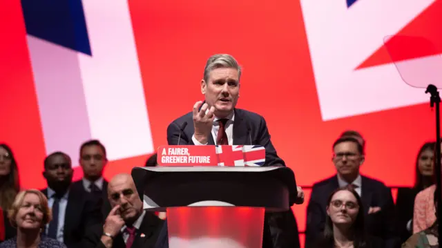 Sir Keir Starmer delivers his speech in front of a large union flag