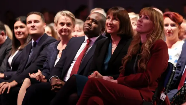 The Labour front bench smile as Starmer delivers his speech