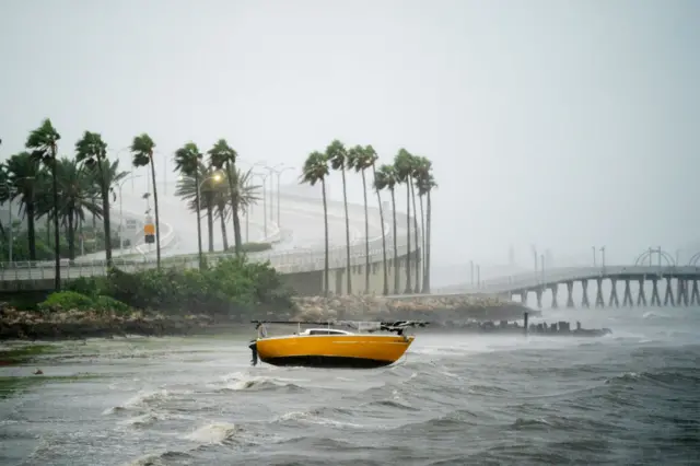 A sail boat at Sarasota Bay amid powerful hurricane wind