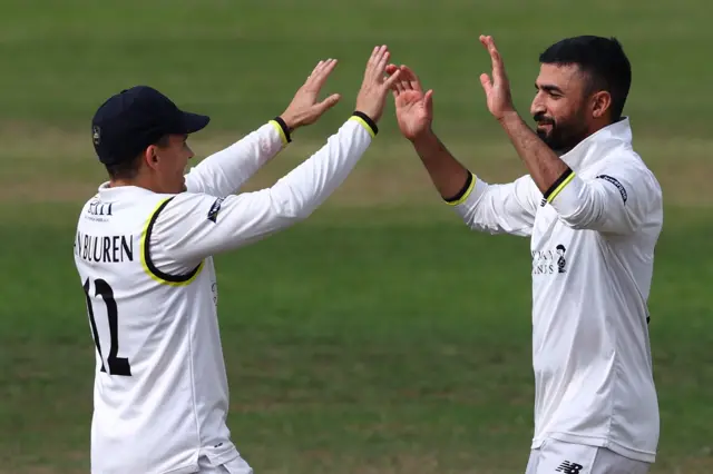 Gloucs captain Graeme van Buuren celebrates with Zafar Gohar