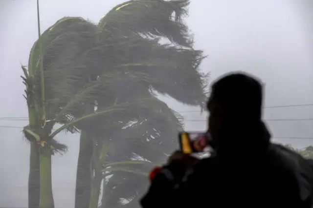 Man on phone in storm