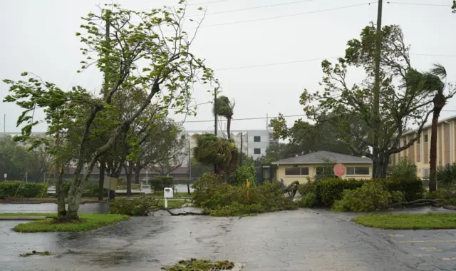 Downed trees and flood waters have been reported around Ft Myers