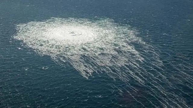 An image shows disturbance on the surface of the Baltic Sea above the site of a leak in one of the pipelines