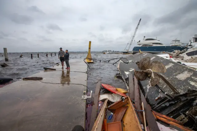 A collapsed building near flooded river aftermath of hurricane in Punta Gorda district of Florida, United States