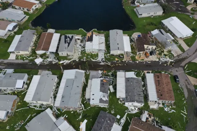 Aerial view showing houses surrounded by debris in Punta Gorda, Florida