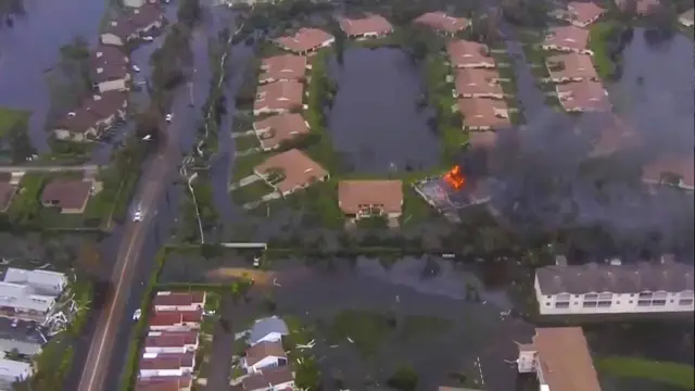 A aerial view of damaged and inundated homes are seen this still image taken from video in Lee County, Florida