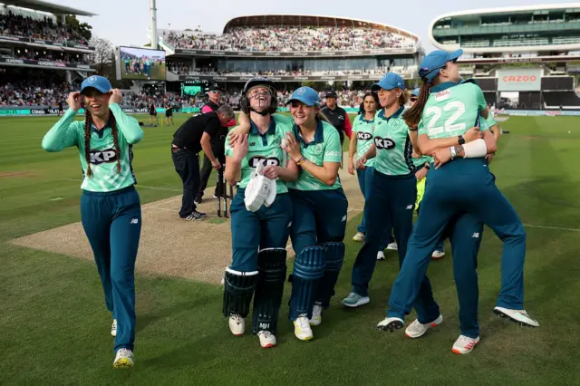 Emily Windsor and Oval Invincibles celebrate winning the women's Hundred