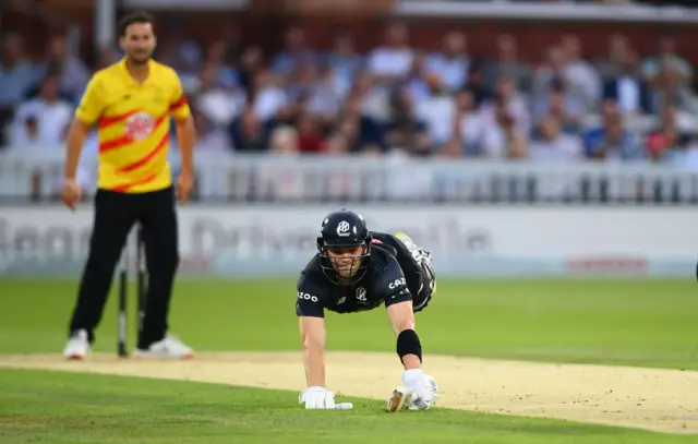 Tristan Stubbs dives for his ground