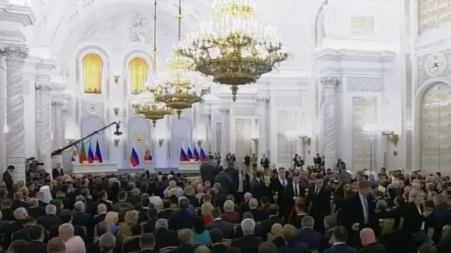 Kremlin hall where Putin will speak fills up