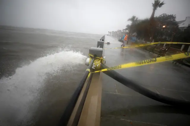 A city pump removes floodwater from a street