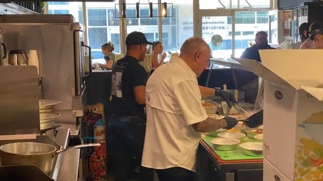 Cal Bruno doling out pasta at his restaurant