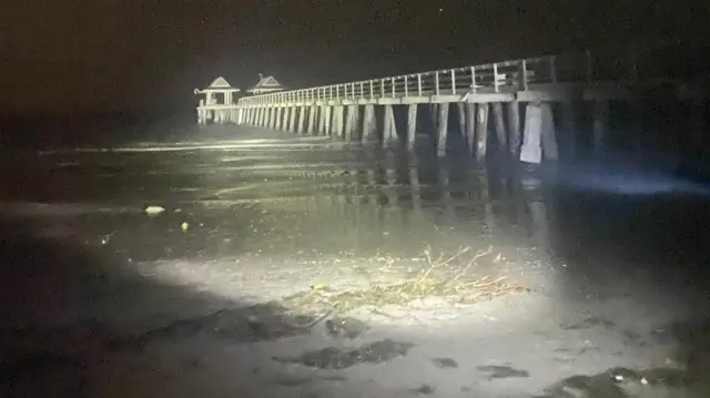 Only half of the Naples pier remains after the storm