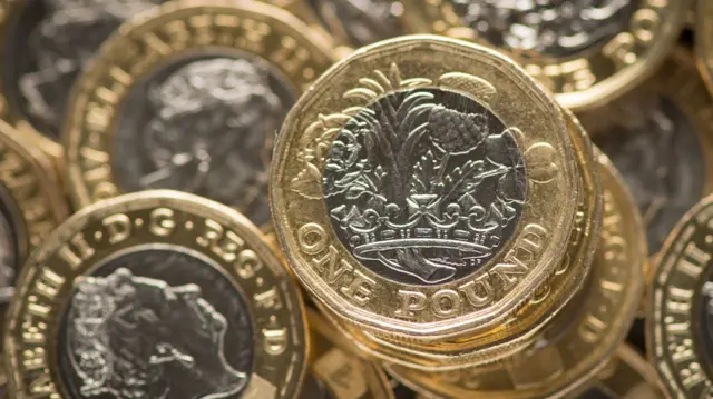 A stock photo showing a pile of pound coins