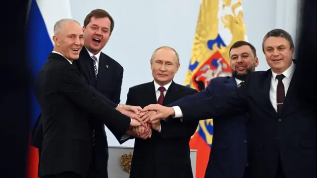 Russian President Vladimir Putin with the Russian-backed leaders of the regions being seized