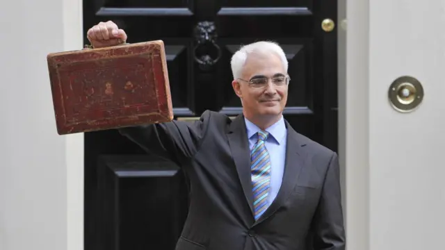 Chancellor of the Exchequer Alistair Darling holds Disraeli's original budget box outside Number 11 Downing Street on April 22, 2009 in London.