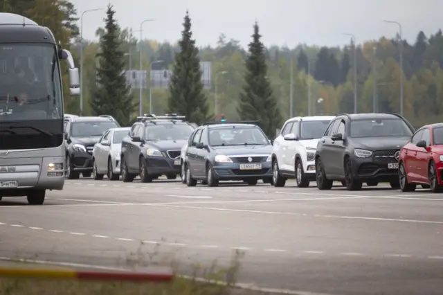 Vehicles coming from Russia wait in lines at the Vaalimaa border check point between Finland and Russia in Virolahti