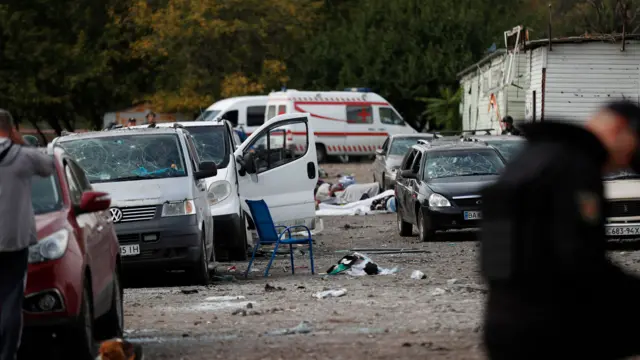 Destroyed vehicles at the scene in Zaporizhzhia, where a convoy of civilians was struck by a Russian missile