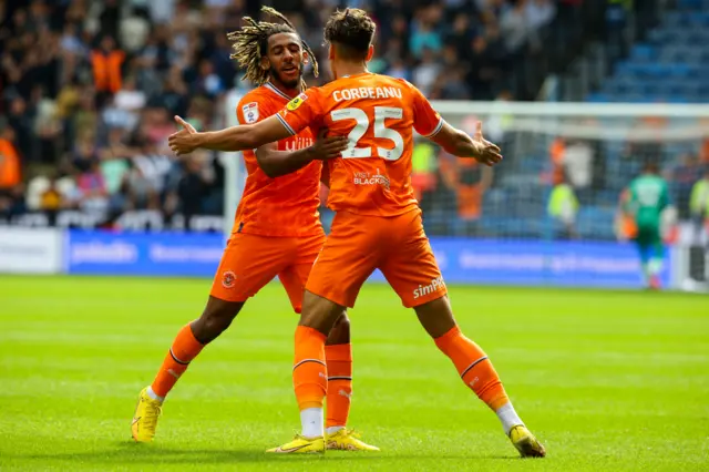 Theo Corbeanu celebrates his goal at Huddersfield