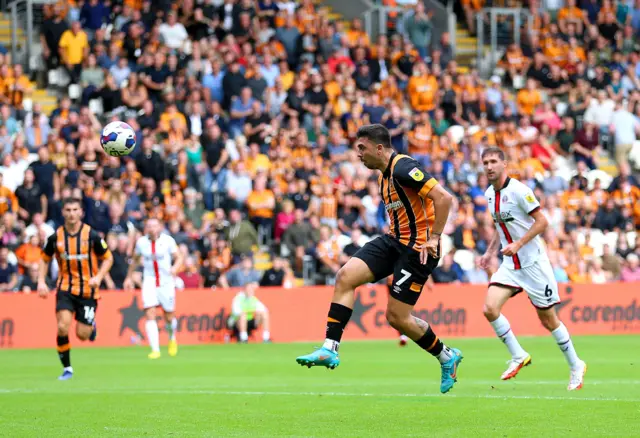 Ozan Tufan shoots at goal