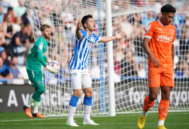 Huddersfield's Yuta Nakayama protests