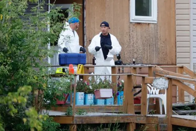 A police forensics team investigates a crime scene after multiple people were killed and injured in a stabbing spree in Weldon, Saskatchewan