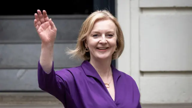 Liz Truss waves after being announced as the new Tory party leader