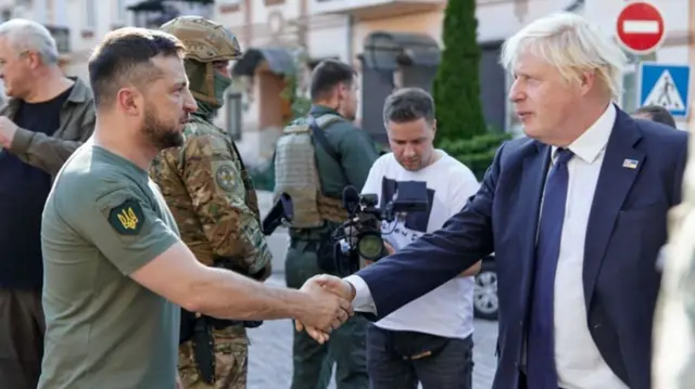 Zelensky and Johnson shake hands in Kyiv