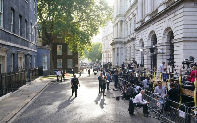 Members of the media gathered outside 10 Downing Street