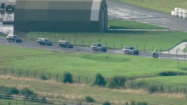 A motorcade driving Liz Truss from RAF Northolt