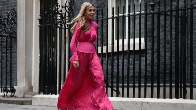 Carrie Johnson walks past No 10 this morning