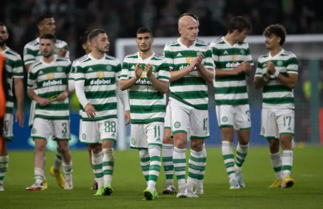 Celtic players applaud the crowd at full-time