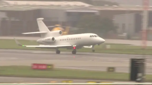 A plane carrying Liz Truss lands at Aberdeen airport