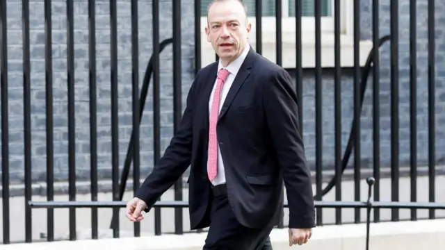 Chris Heaton-Harris walks outside Downing Street, in London