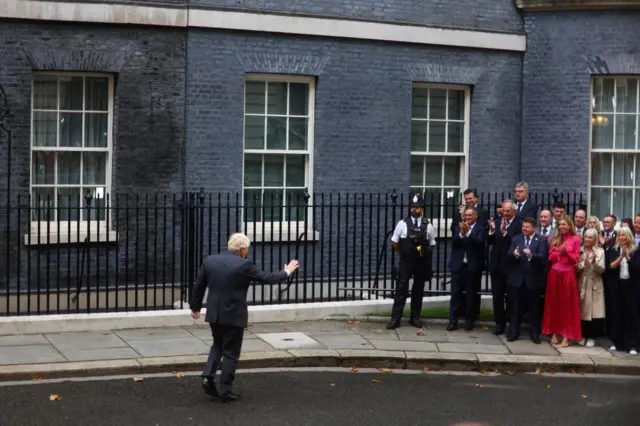 Boris Johnson heads to greet his wife Carrie after making his speech in Downing Street