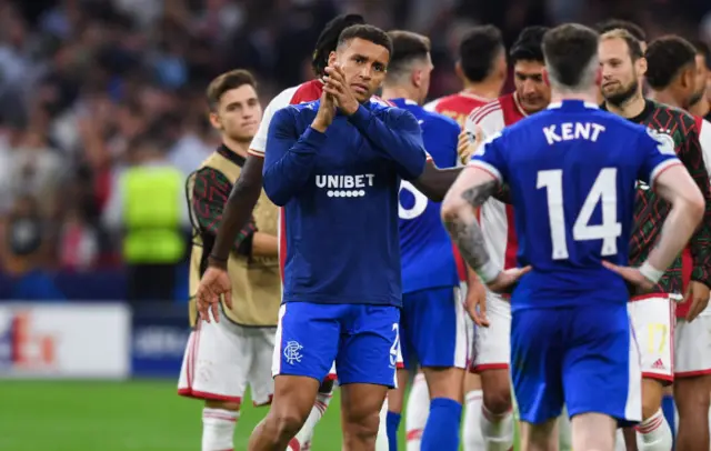 Rangers captain James Tavernier applauds the visiting fans in Amsterdam