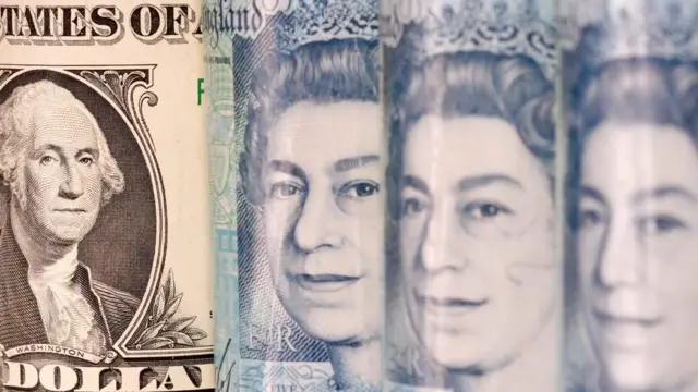 Stock image of dollar bills and UK pound notes