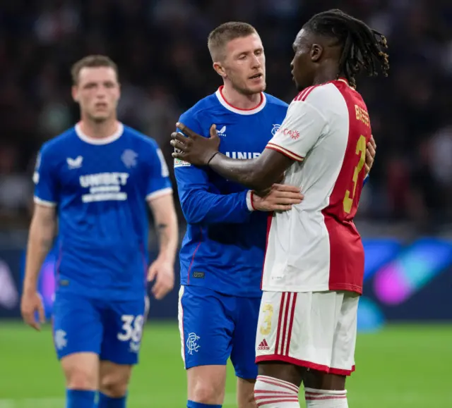 Calvin Bassey shares an embrace with John Lundstram at full-time