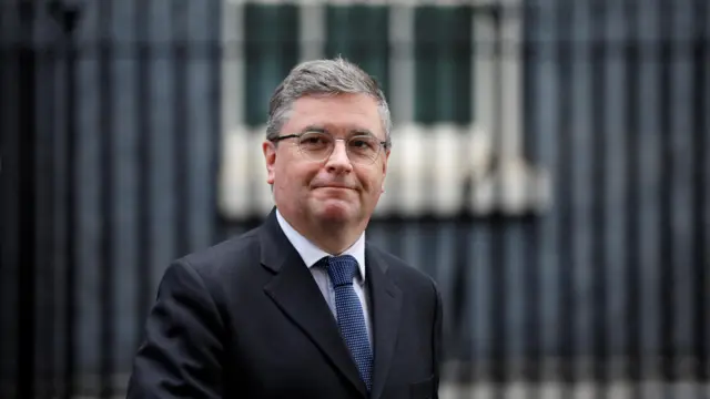 Secretary of State for Wales Robert Buckland walks outside the cabinet building this morning