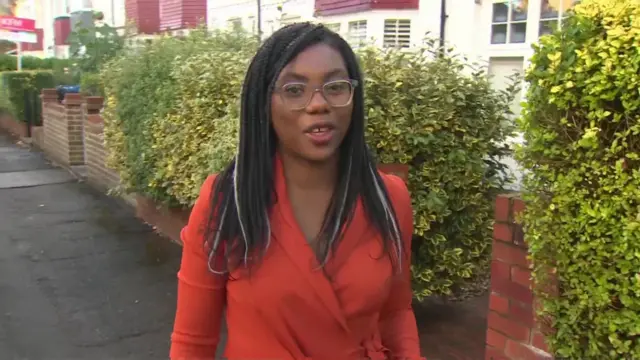 Kemi Badenoch speaks to reporters when leaving her home this morning